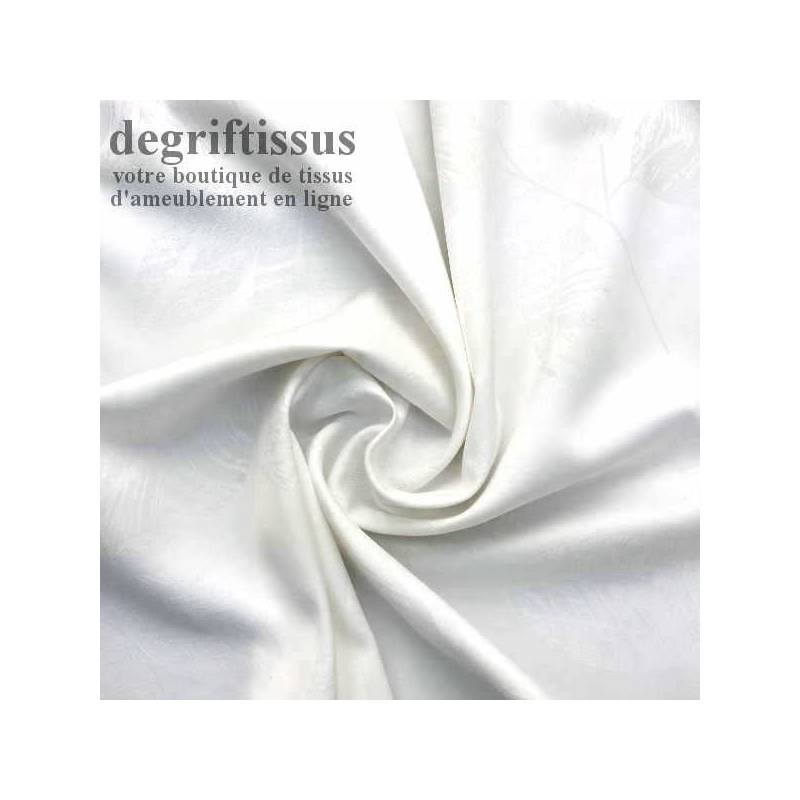 Dégriftissus vous propose ce tissu d'ameublement double face satiné blanc à fleurs striées Vous allez pouvoir agrémenter votre 